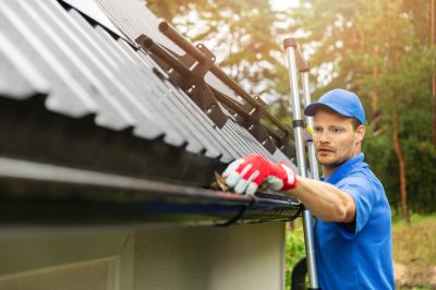Maintenance Crew Installing Gutter Covers